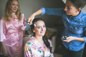 Young woman is being made up for the wedding, portrait