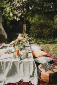 Festive laid table at alternative wedding celebration outside