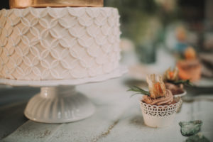 Festive laid table at alternative wedding celebration outside, detail