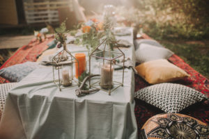 Festive laid table at alternative wedding celebration outside