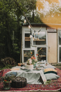Festive laid table at alternative wedding celebration outside