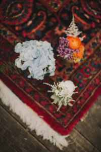 Floral decoration on carpet at alternative wedding celebration, close up