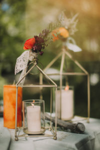 Candles on Festive laid table at wedding celebration, close up