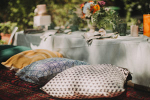 Festive laid table at alternative wedding celebration outside, detail