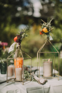Candles on Festive laid table at wedding celebration, close up