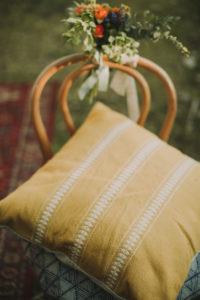 Alternative wedding, decoration, chair, flowers, cushions, medium close-up 