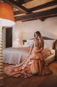Woman, evening dress, bed, sitting,