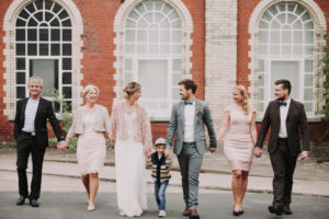 Wedding photo, newlyweds, bridal parents, groomsmen, son, walk, hand in hand,