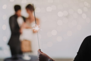Bridal couple, blur, detail, woman holding sparkler,