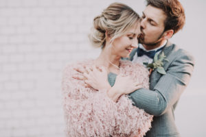 Bridal couple in love, hug, half portrait, detail,