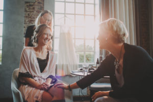 Bride with stylist and bride's mother, happy, hairstyle,