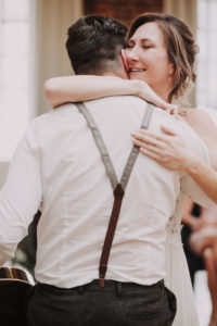 Happy bride hugs a man, congratulations,