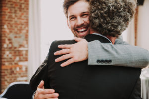 Wedding, groom and senior, hug, smile,