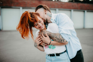 Young couple in love, fun, fooling around, outside