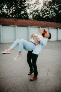 Young couple in love, fun, fooling around, outside