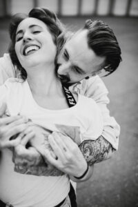 Young couple in love, fun, fooling around, outside