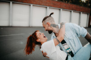 Young couple in love, fun, fooling around, outside