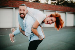 Young couple in love, fun, fooling around, outside