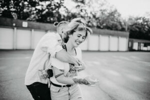 Young couple in love, fun, fooling around, outside