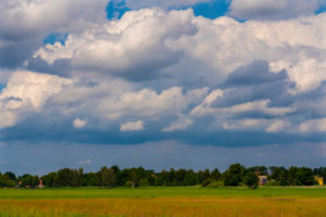 Agricultural area on a sunny day in summer with big clouds Agricultural area on a sunny day in summer with big clouds