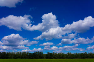 Agricultural area on a sunny day in summer with big clouds Agricultural area on a sunny day in summer with big clouds
