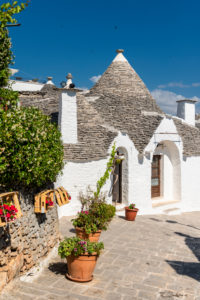 Alberobello, Bari province, Salento, Puglia, Italy, Europe. The typical trulli houses with their cone-shaped roof in the drywall style