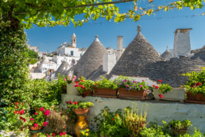Alberobello, Bari province, Salento, Puglia, Italy, Europe. The typical trulli houses with their cone-shaped roof in the drywall style
