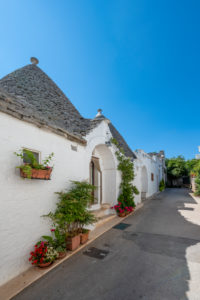 Alberobello, Bari province, Salento, Puglia, Italy, Europe. The typical trulli houses with their cone-shaped roof in the drywall style