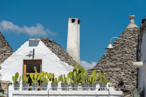Alberobello, Bari province, Salento, Puglia, Italy, Europe. The typical trulli houses with their cone-shaped roof in the drywall style