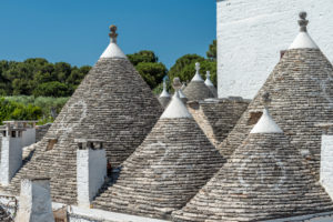 Alberobello, Bari province, Salento, Puglia, Italy, Europe. The typical trulli houses with their cone-shaped roof in the drywall style