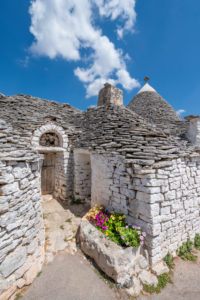 Alberobello, Bari province, Salento, Puglia, Italy, Europe. The typical trulli houses with their cone-shaped roof in the drywall style