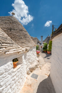 Alberobello, Bari province, Salento, Puglia, Italy, Europe. The typical trulli houses with their cone-shaped roof in the drywall style