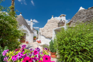 Alberobello, Bari province, Salento, Puglia, Italy, Europe. The typical trulli houses with their cone-shaped roof in the drywall style