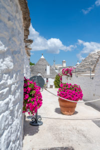 Alberobello, Bari province, Salento, Puglia, Italy, Europe. The typical trulli houses with their cone-shaped roof in the drywall style