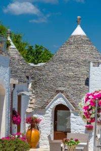 Alberobello, Bari province, Salento, Puglia, Italy, Europe. The typical trulli houses with their cone-shaped roof in the drywall style