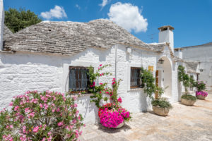 Alberobello, Bari province, Salento, Puglia, Italy, Europe. The typical trulli houses with their cone-shaped roof in the drywall style