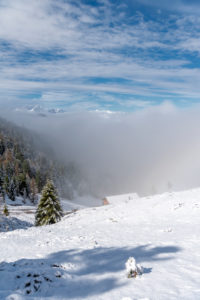 Percha, Bolzano province, South Tyrol, Italy. Snow in spring above the Gönner Alm. In the background the Dolomites Percha, Bolzano province, South Tyrol, Italy. Snow in spring above the Gönner Alm. In the background the Dolomites