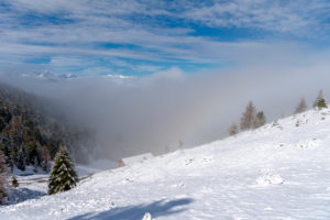 Percha, Bolzano province, South Tyrol, Italy. Snow in spring above the Gönner Alm. In the background the Dolomites Percha, Bolzano province, South Tyrol, Italy. Snow in spring above the Gönner Alm. In the background the Dolomites