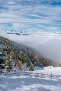 Percha, Bolzano province, South Tyrol, Italy. Snow in spring above the Gönner Alm. In the background the Dolomites Percha, Bolzano province, South Tyrol, Italy. Snow in spring above the Gönner Alm. In the background the Dolomites