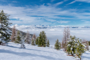 Percha, Bolzano province, South Tyrol, Italy. Snow in spring above the Gönner Alm. In the background the Dolomites Percha, Bolzano province, South Tyrol, Italy. Snow in spring above the Gönner Alm. In the background the Dolomites