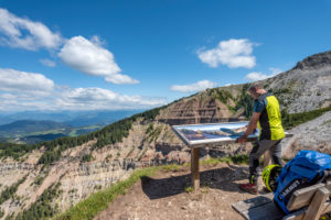 Aldein, Province of Bolzano, South Tyrol, Italy. Geoparc Bletterbach. A panorama board above the Gorz, the end of the Bletterbach gorge Aldein, Province of Bolzano, South Tyrol, Italy. Geoparc Bletterbach. A panorama board above the Gorz, the end of the Bletterbach gorge