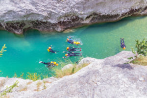 Group of people canyoning in Verdon river, Gorge du Verdon, Alpes de Haute Provence, Provence, France Group of people canyoning in Verdon river, Gorge du Verdon, Alpes de Haute Provence, Provence, France