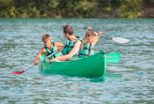 Family canoeing on Esparron de Verdon lake, Esparron de Verdon, Alpes de Haute Provence, Provence, France, Europe, Family canoeing on Esparron de Verdon lake, Esparron de Verdon, Alpes de Haute Provence, Provence, France, Europe,