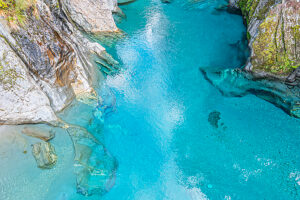 View of the blue pools on the Marokopa River, Haast Pass, Mount Aspiring National Park, Otago Region, South Island, New Zealand
