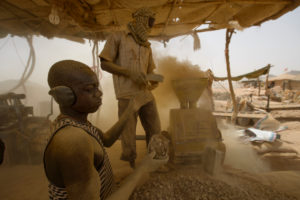 Gold prospectors at work in the Delgo gold market in the Sahara, Sudan