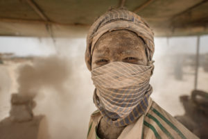 Gold prospectors at work in the Delgo gold market in the Sahara, Sudan