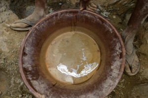 Gold prospectors at work in the Delgo gold market in the Sahara, Sudan