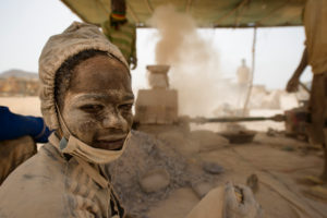 Gold prospectors at work in the Delgo gold market in the Sahara, Sudan