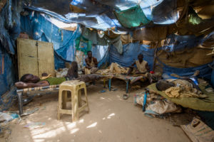 Gold digger in the dormitory in the Delgo gold market of the Sahara, Sudan