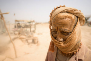 Gold prospectors at work in the Delgo gold market in the Sahara, Sudan